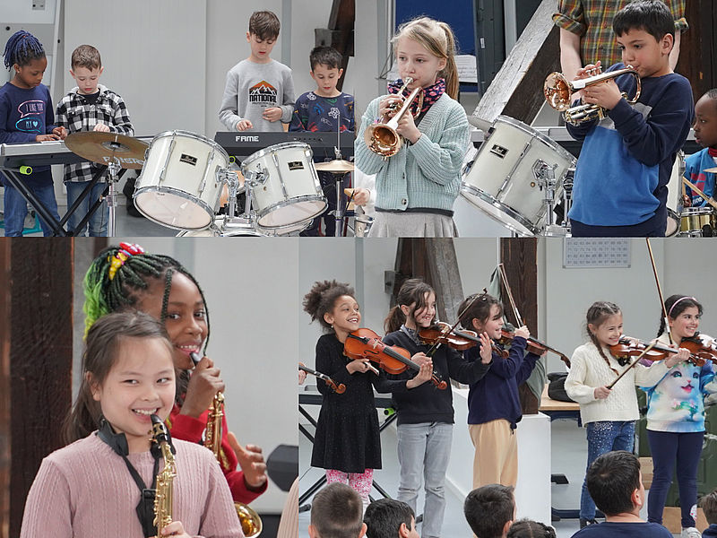 Große Säcke mit Pfanddosen gefüllt und einem motivierten Zukunftsmusik Helfer, der sich freut